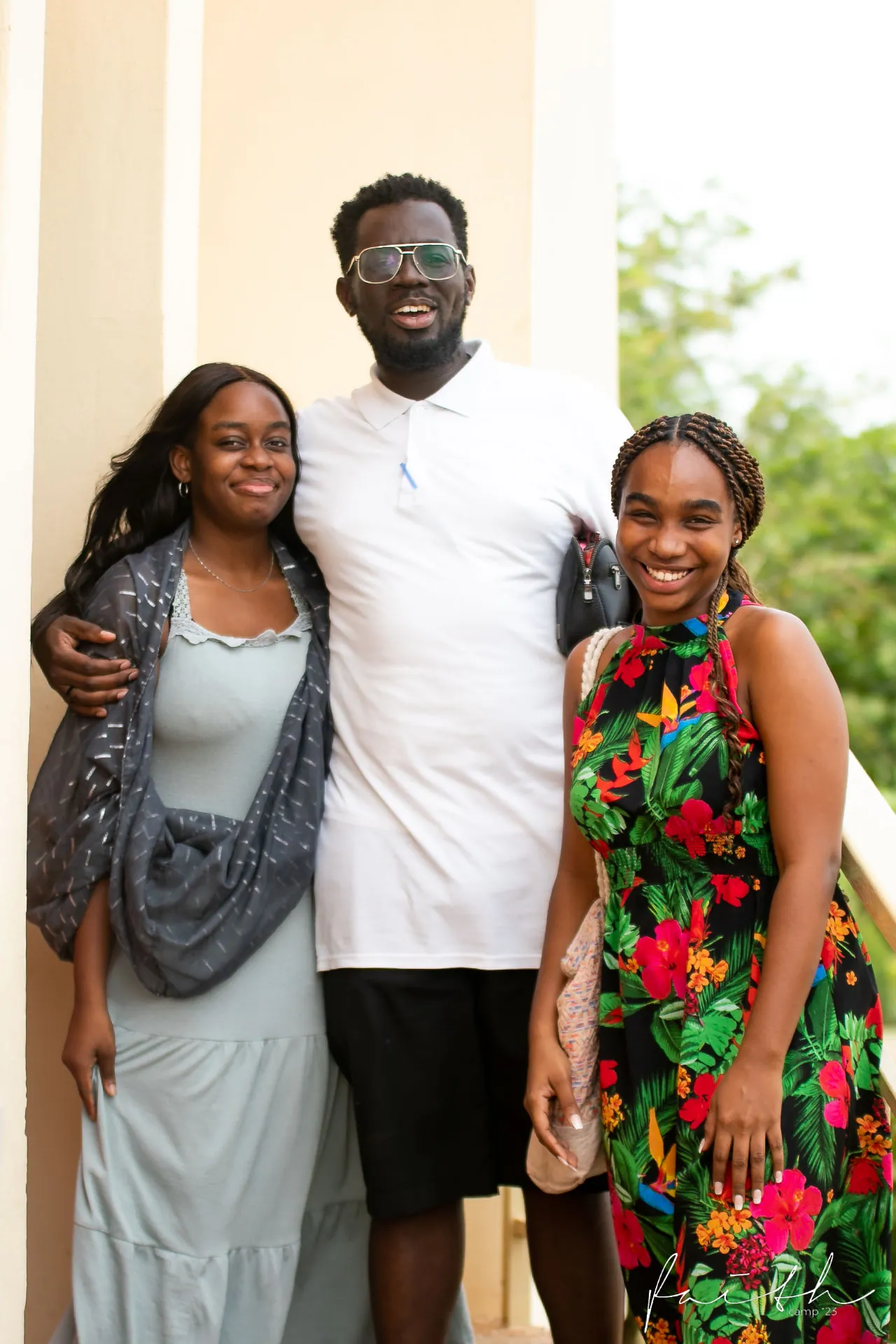 Three friends arm in arm at Faith Camp