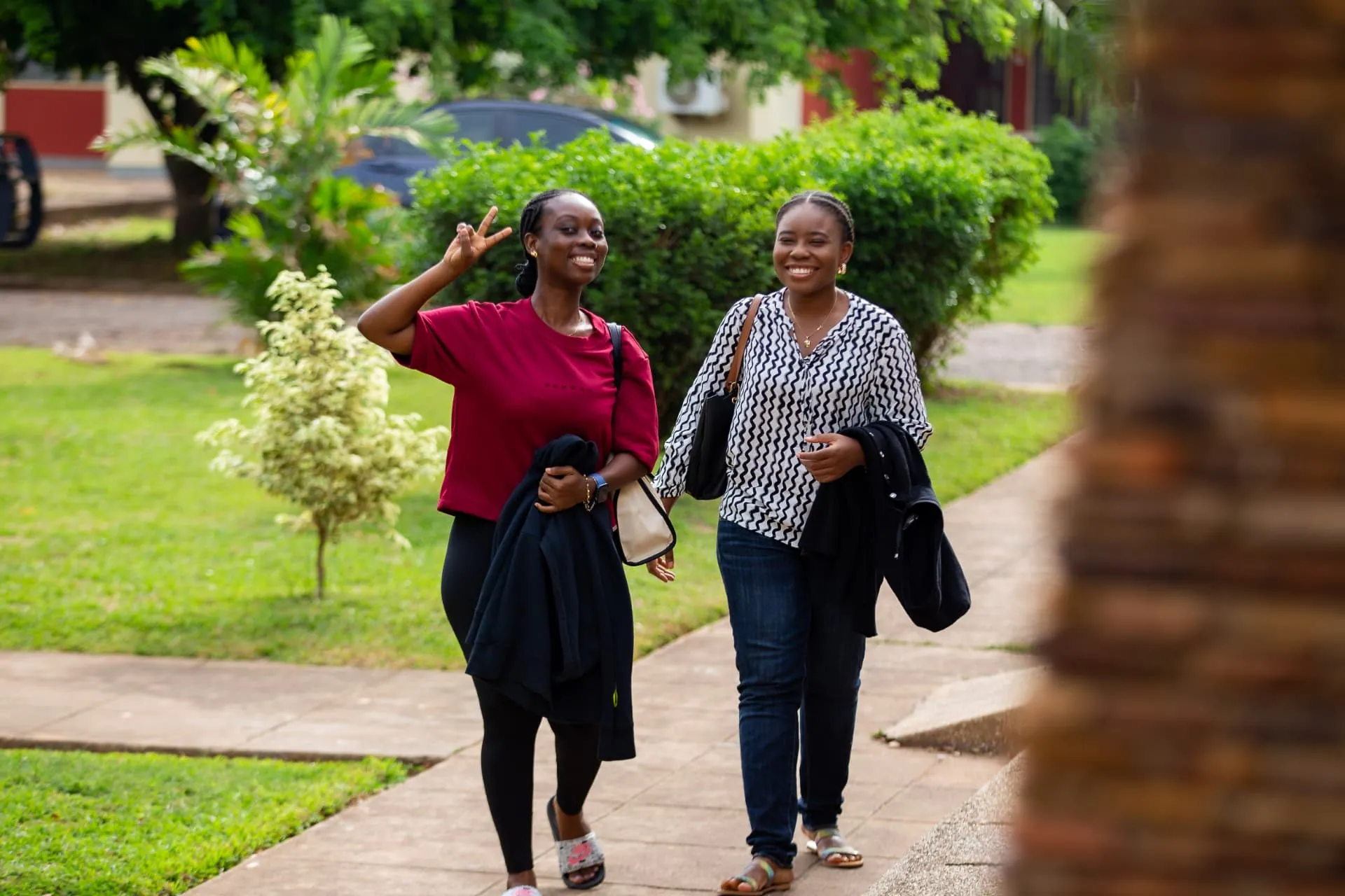 Two members walking in together at Faith Camp