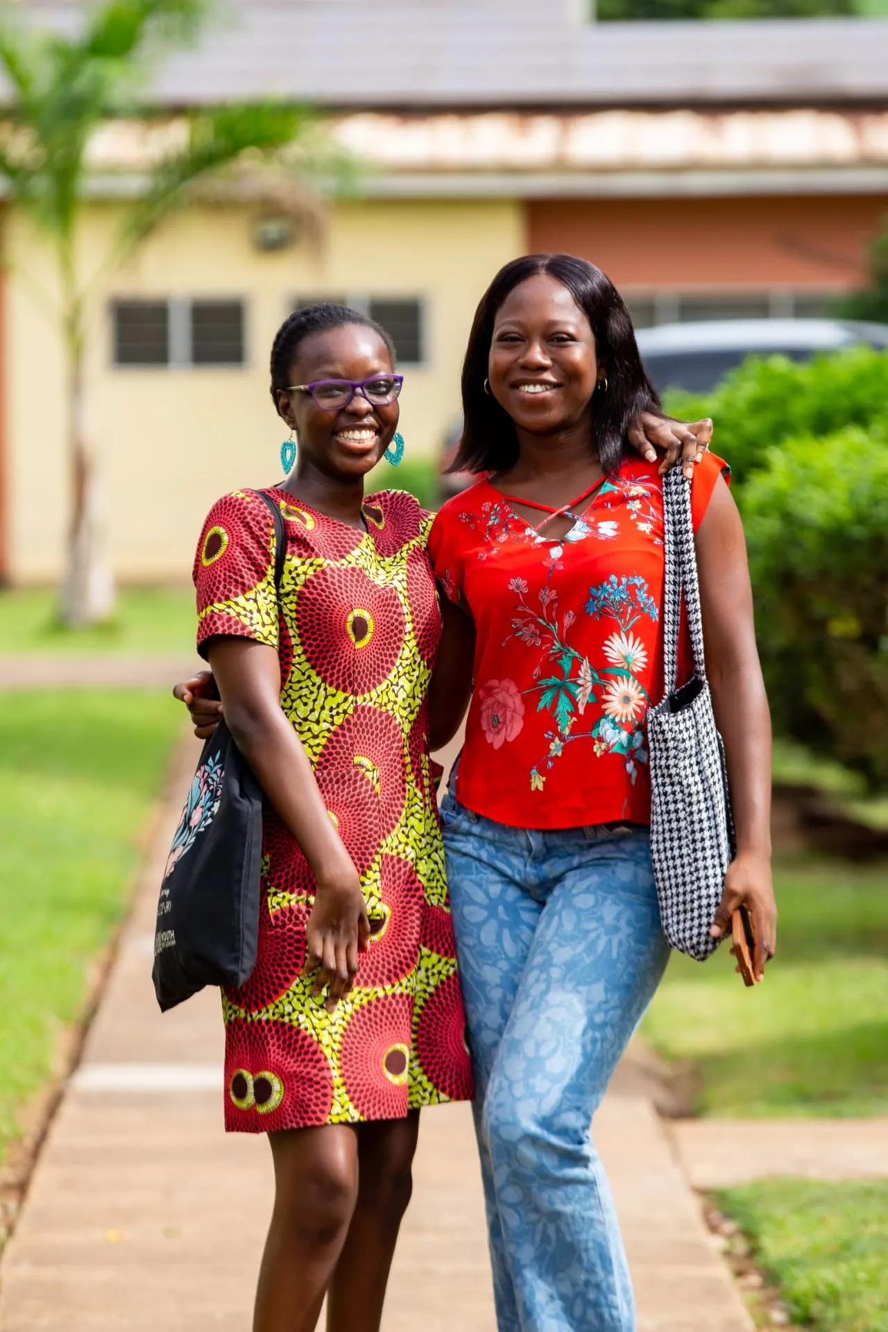 Two friends arm in arm at Faith Camp